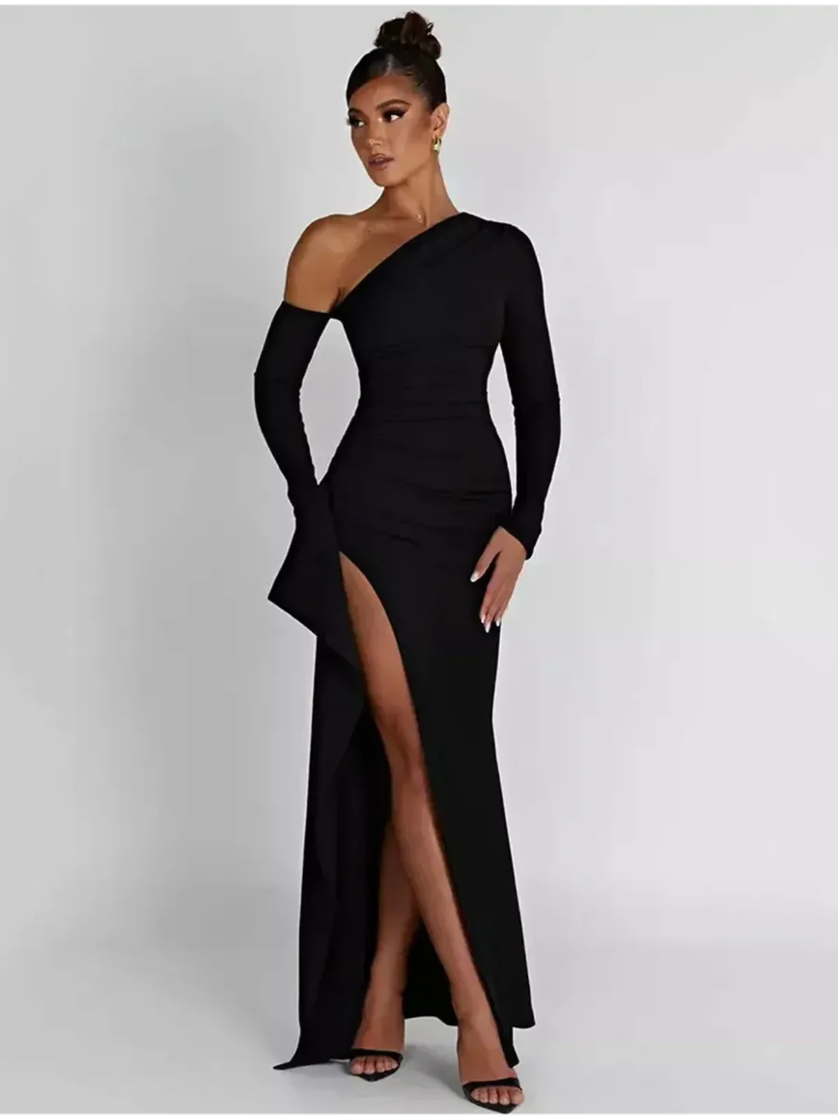 Obsidian Grace Maxi Dress in black, featuring an asymmetric one-shoulder design and a daring thigh-high slit.