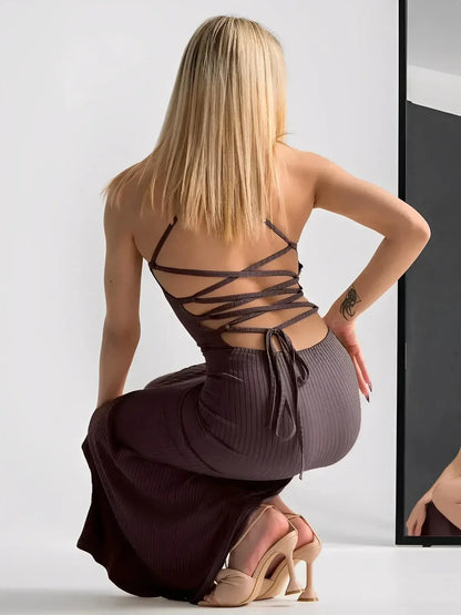 Lauven Obsidian Midi Dress with strappy back, showcasing sculpted fit and elegant thigh-high slit.