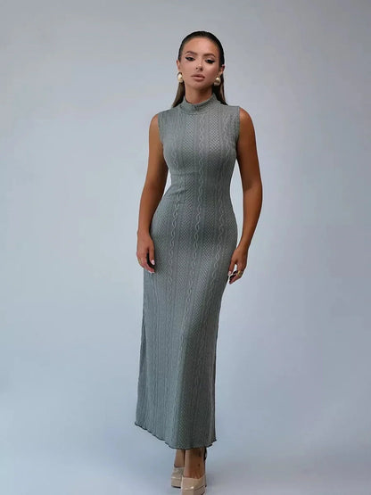 Obsidian Veil Maxi Dress in textured green with a sculptural fit, perfect for elegant occasions.