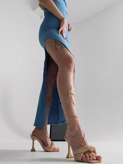 Ocean Lace Midi Dress by Lauven featuring a side slit, showcasing legs and stylish footwear.