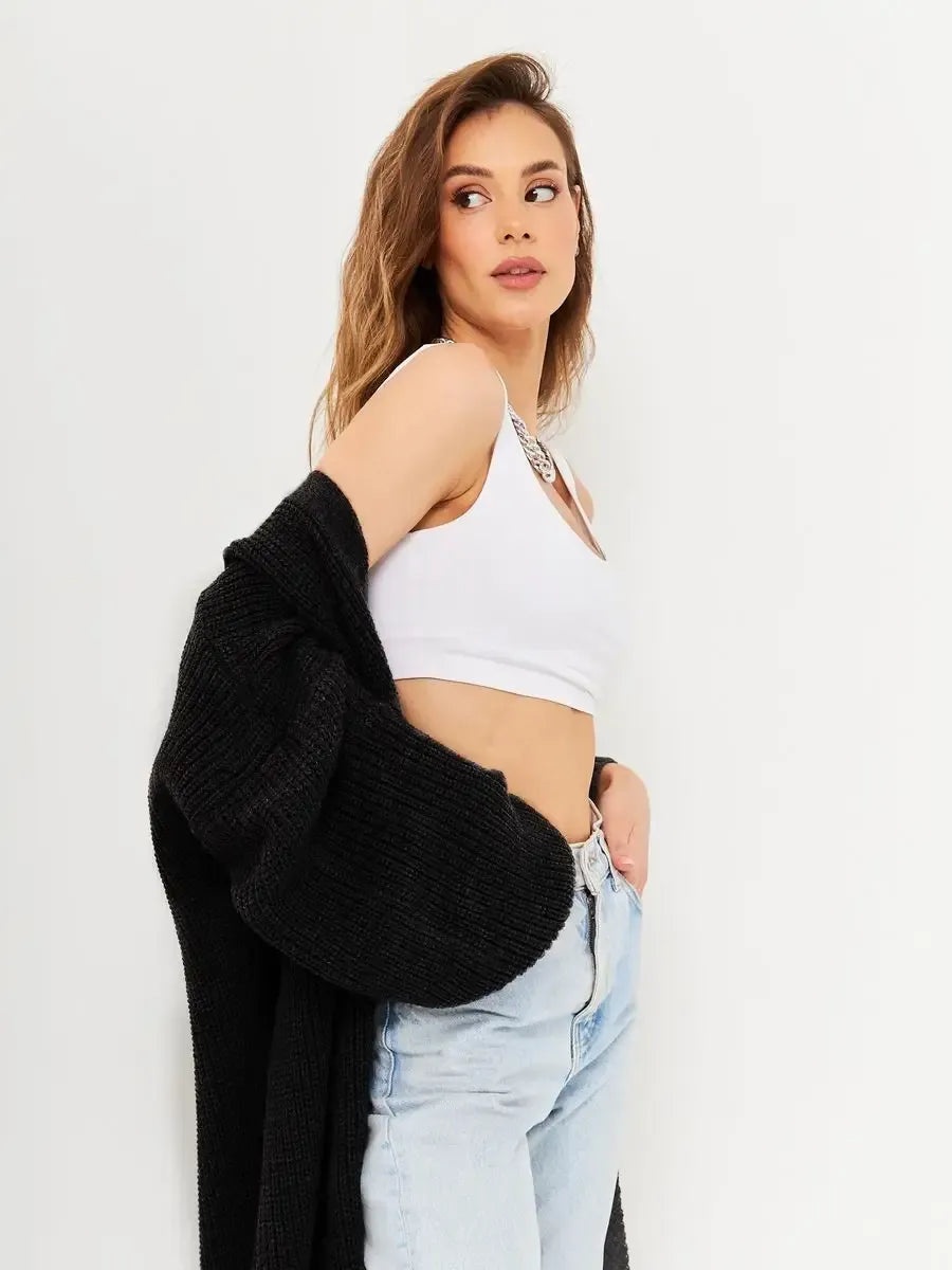 Onyx Cardigan by Lauven – Cozy oversized chunky knitwear for women, styled with a white crop top and denim.