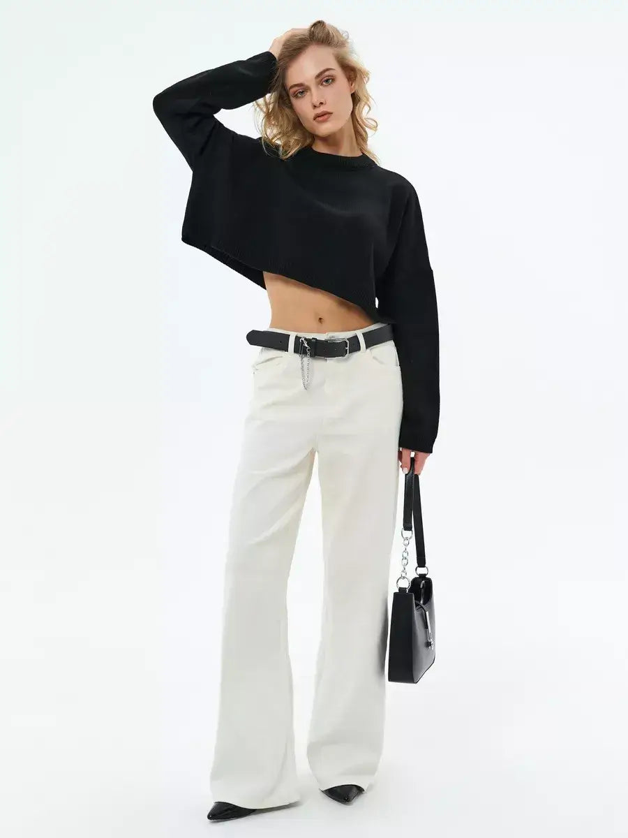 Onyx Sweater by Lauven, cropped oversized knit in black, paired with wide-leg pants and stylish accessories.