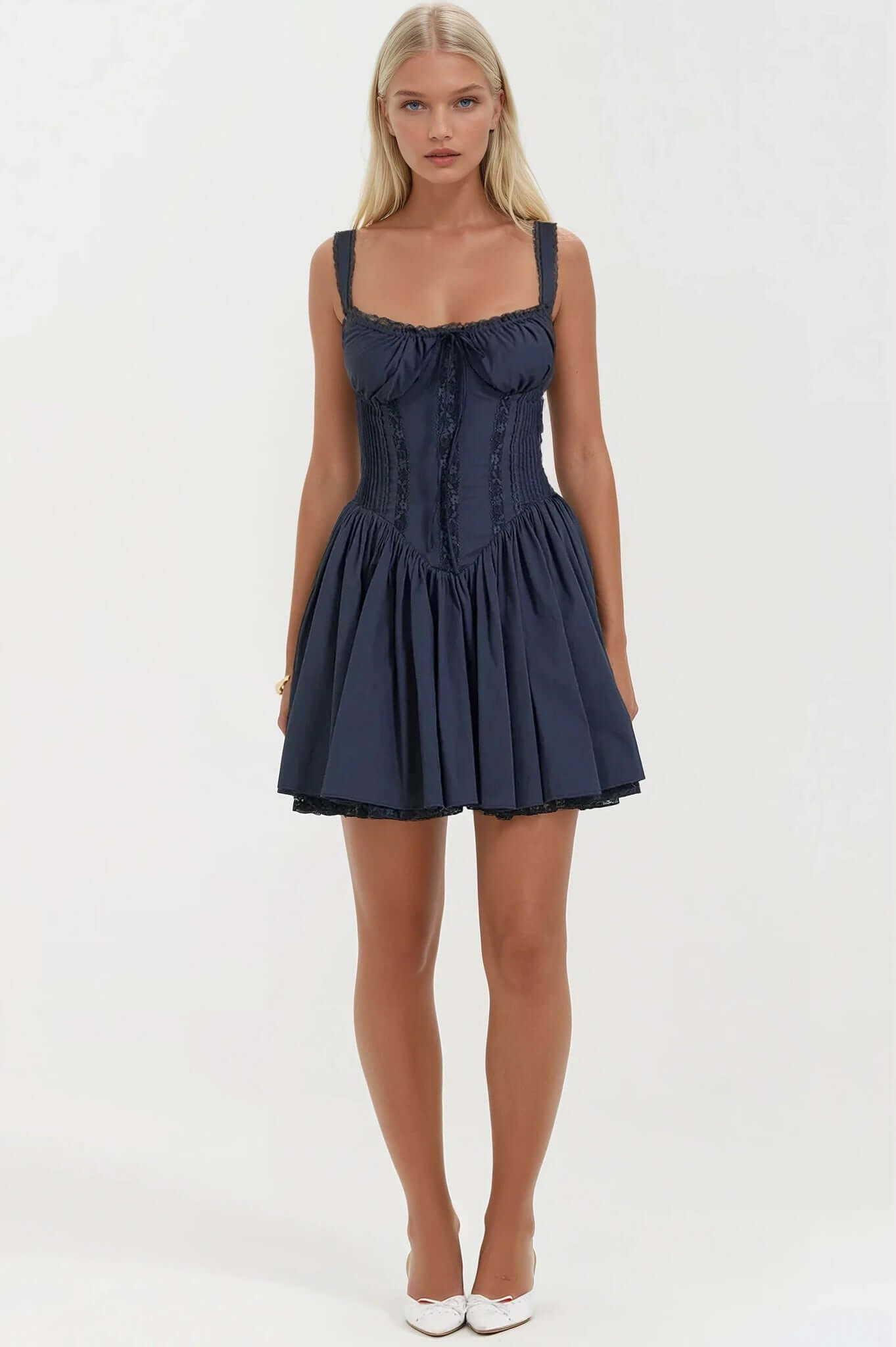 Elegant navy mini dress featuring a fitted bodice and a flowy skirt, perfect for summer parties or formal events.