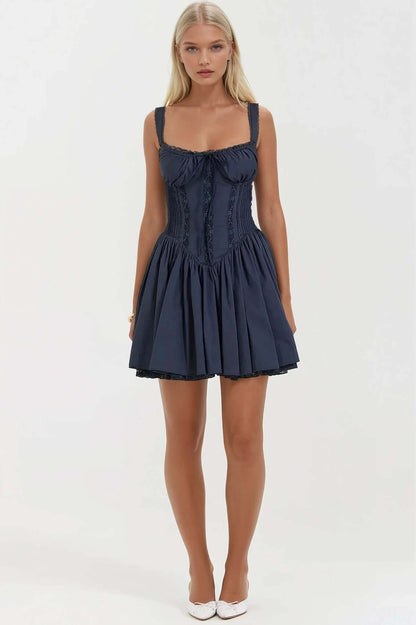 Elegant navy mini dress featuring a fitted bodice and a flowy skirt, perfect for summer parties or formal events.