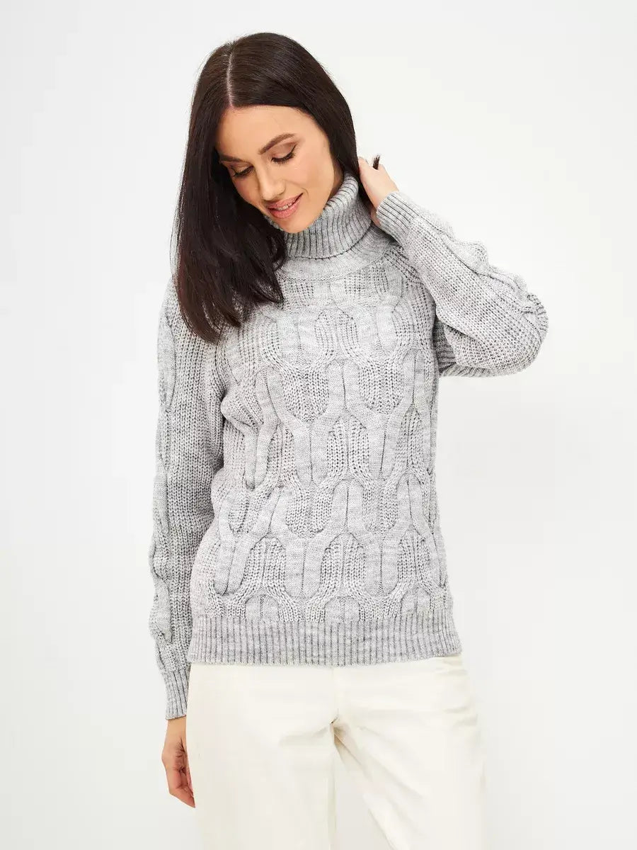 Model wearing an Osiris Sweater by Lauven in gray melange, featuring oversized cable knit and high neck.