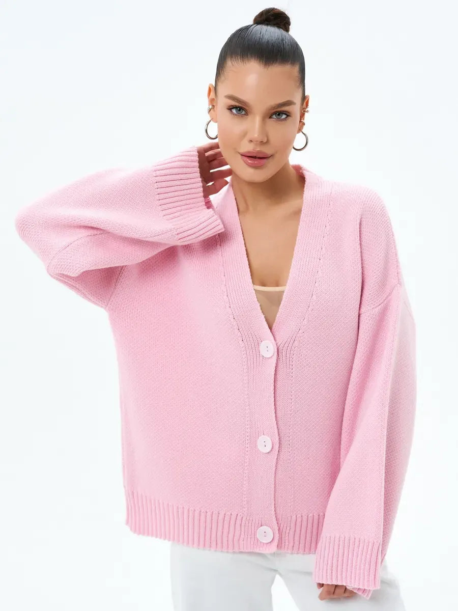 Petal Cardigan by Lauven in soft pastel pink, featuring oversized knitwear and elegant button closure.