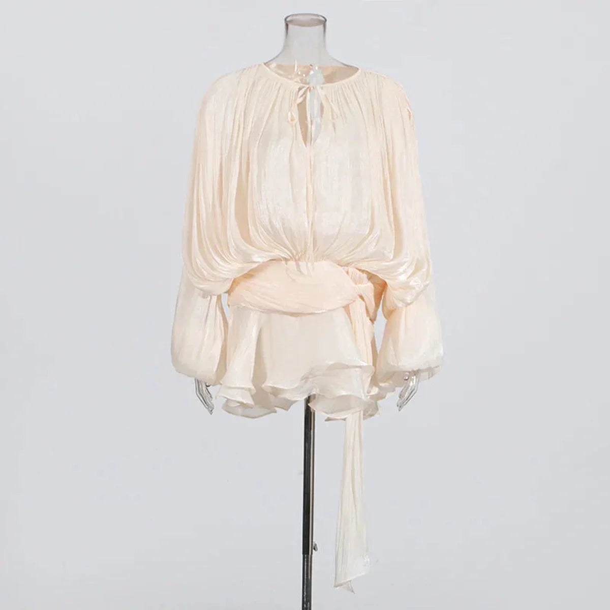 Ivory pleated chiffon mini dress with long sleeves and a keyhole neckline, perfect for summer and evening events.