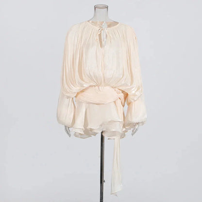 Ivory pleated chiffon mini dress with long sleeves and a keyhole neckline, perfect for summer and evening events.