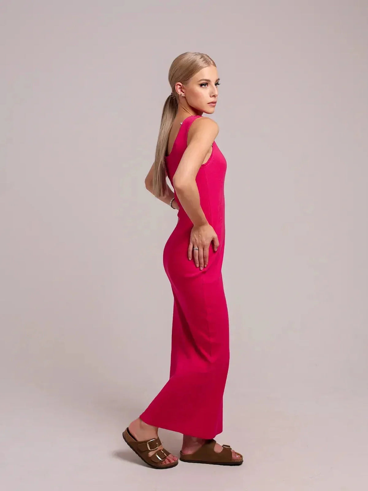 Model in a fuchsia Radiance Maxi Dress, showcasing a sleek silhouette and stylish comfort.