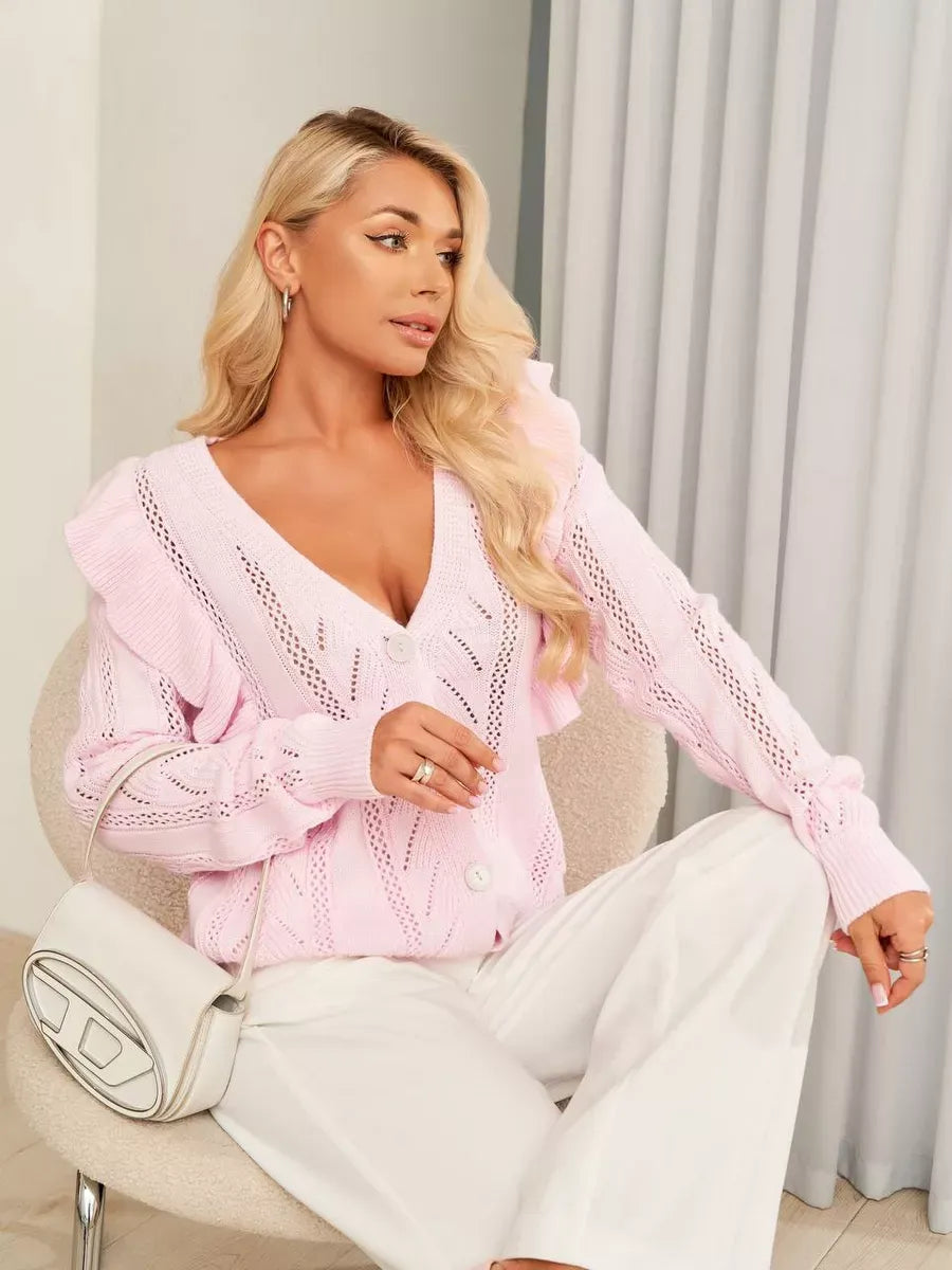 Roselle Cardigan by Lauven in soft pink with ruffles and button closure, showcasing elegant open-knit design.