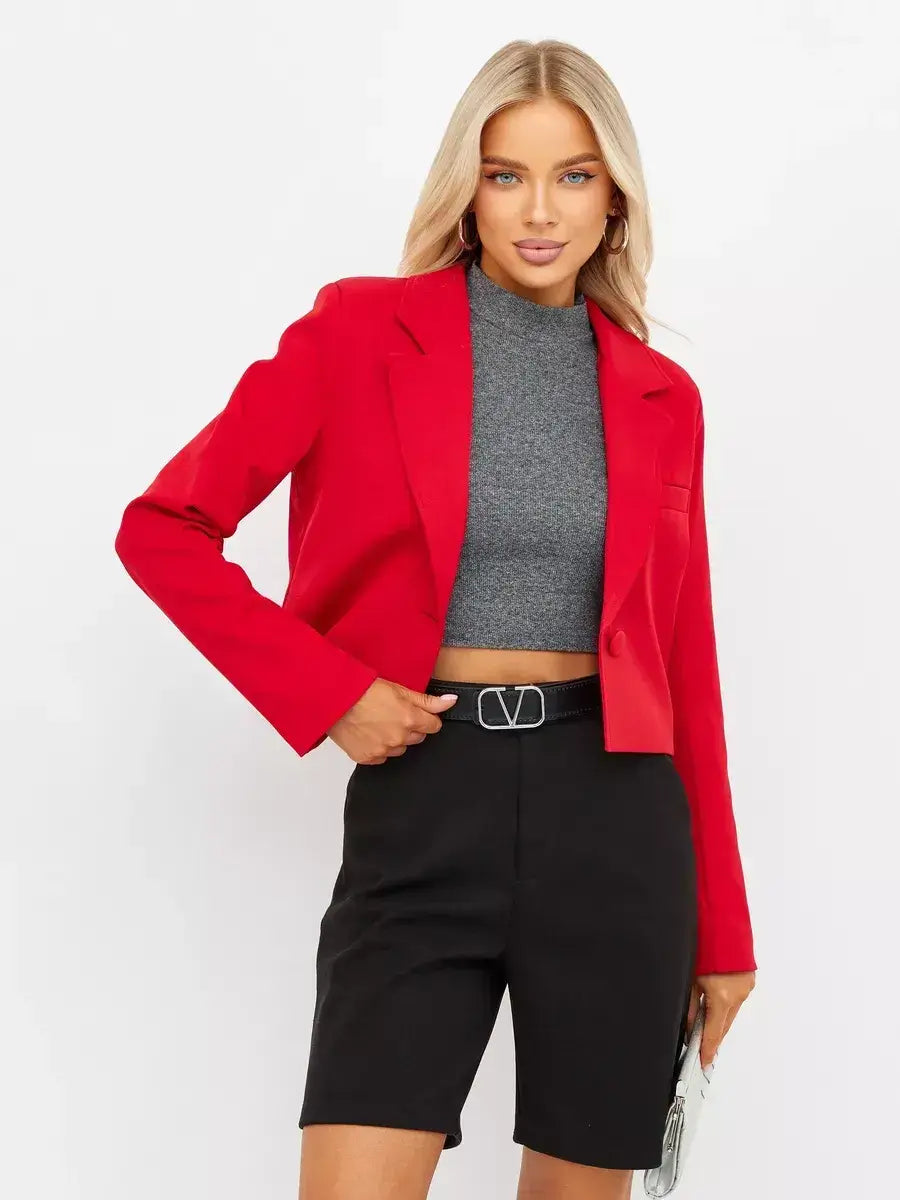 Ruby Blazer by Lauven, a cropped red tailored blazer styled with a gray top and black shorts.