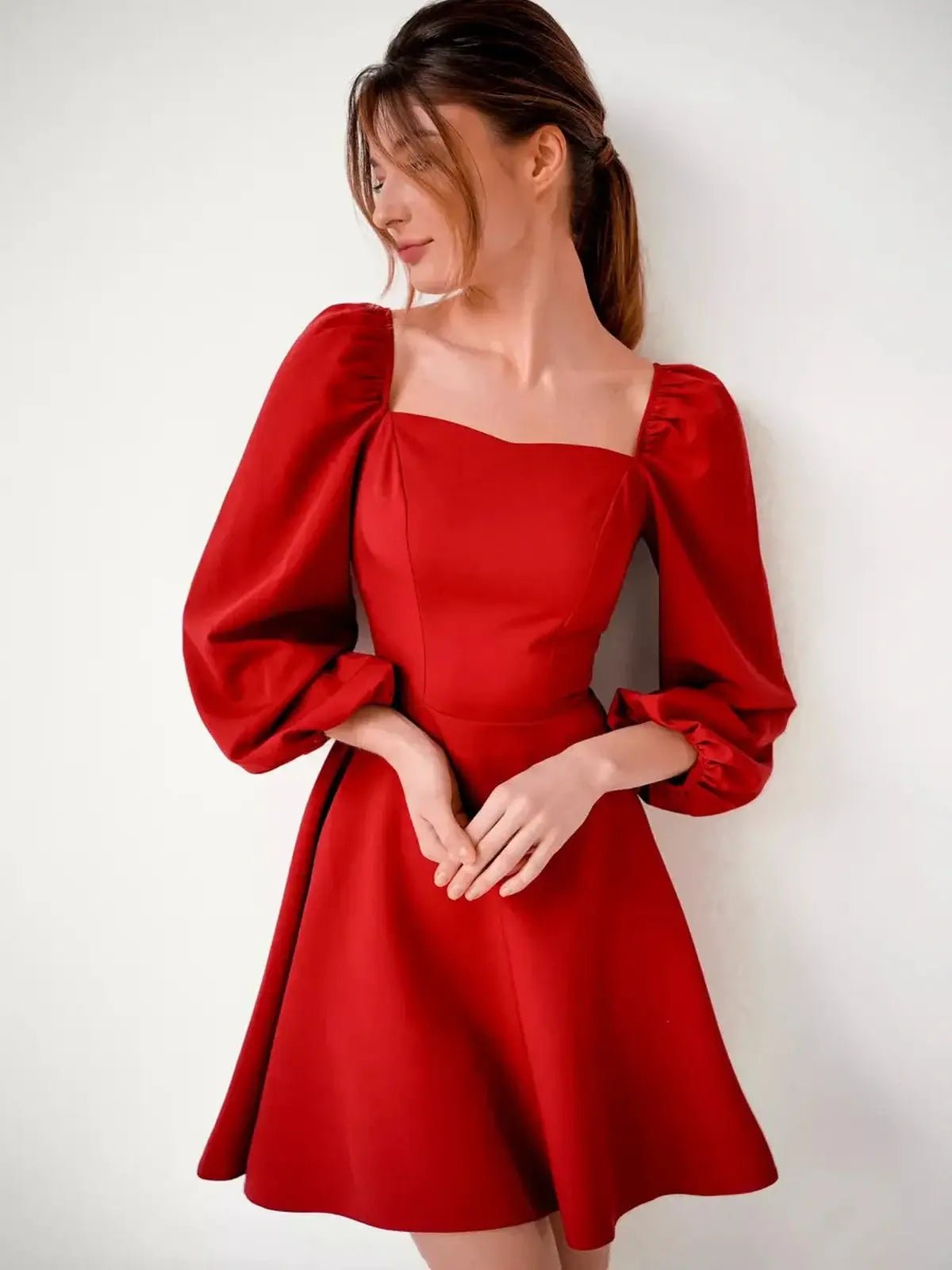 Elegant Ruby Flare mini dress in red with puff sleeves and square neckline, perfect for parties and weddings.