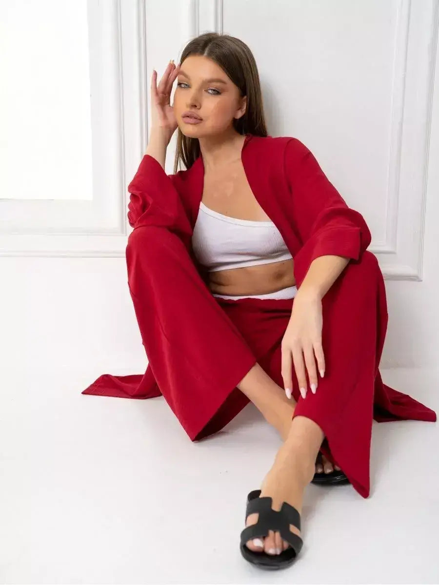 Ruby Suit Set by Lauven – Vibrant red oversized two-piece set featuring wide-leg trousers and a stylish open jacket.