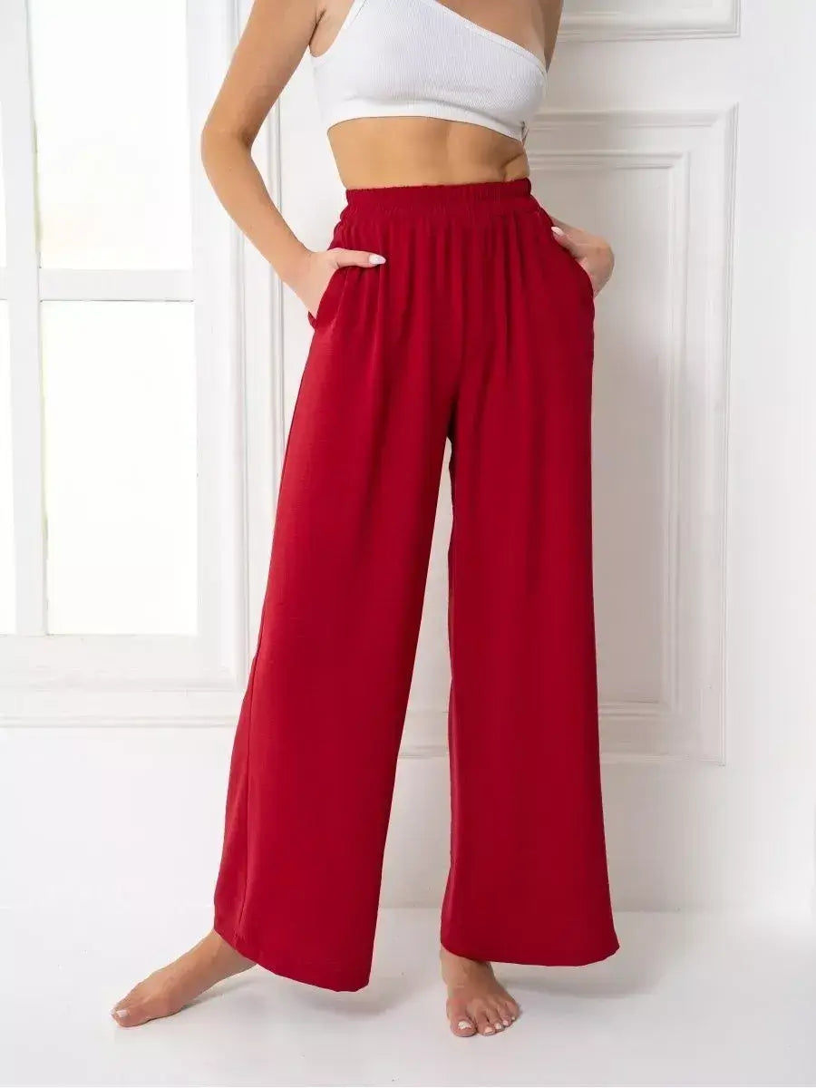 Ruby Suit Set featuring vibrant red wide-leg trousers with pockets, designed by Lauven for elegance and comfort.