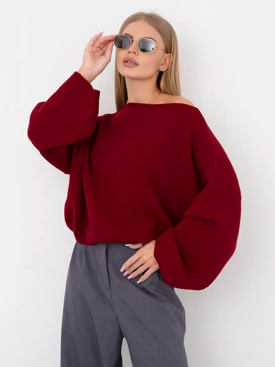 Oversized Ruby Sweater by Lauven in deep ruby red with boat neckline and stylish sunglasses.
