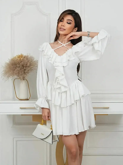 Elegant woman in a Ruffle Bloom Mini Dress with ruffles and off-shoulder style, perfect for summer events and weddings.