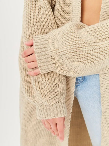 Close-up of sleeves of Sable Cardigan by Lauven, showcasing soft knit texture and oversized fit.