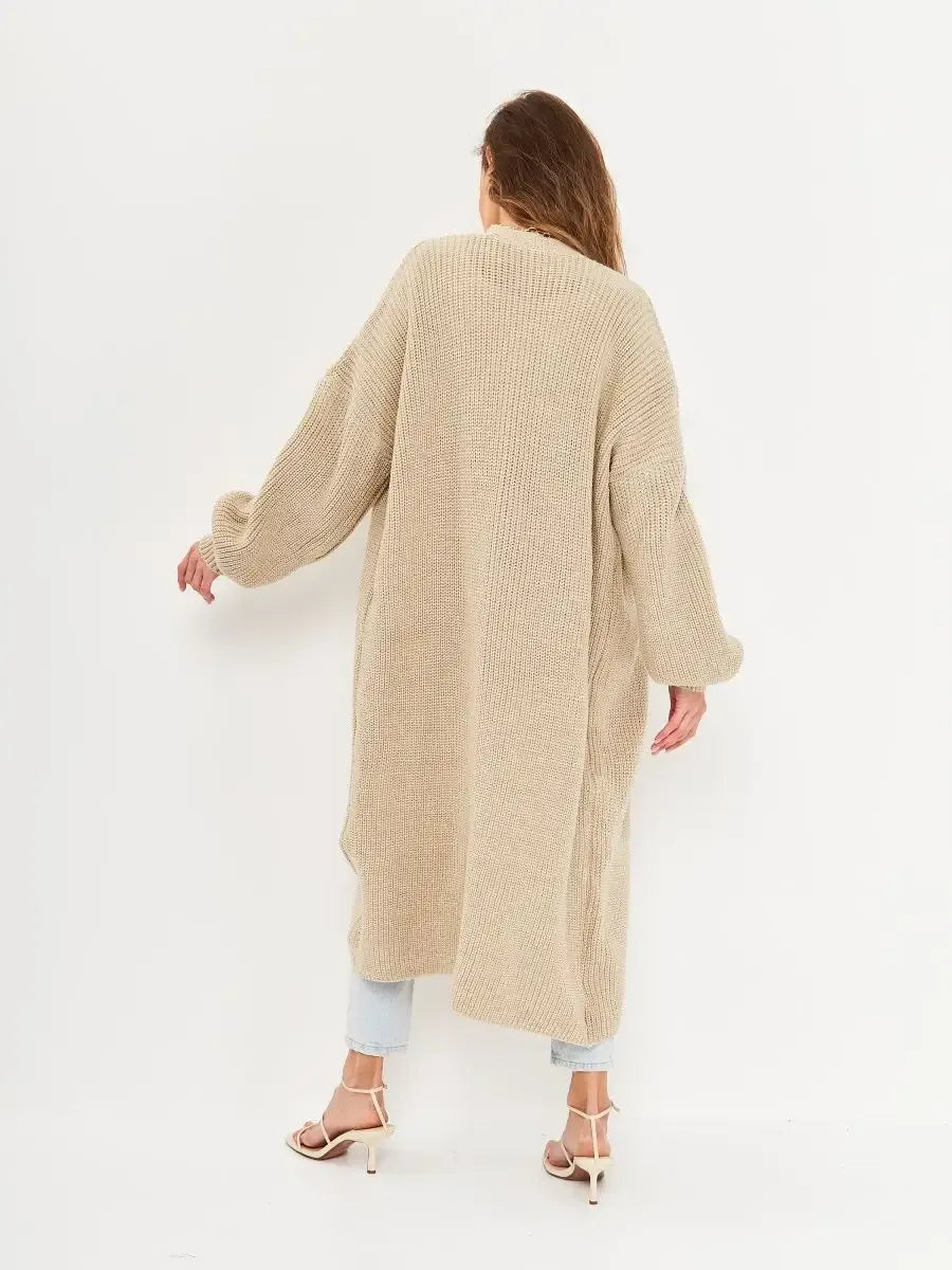 Sable Cardigan by Lauven, back view of long oversized knitwear coat in beige, showcasing comfort and style.