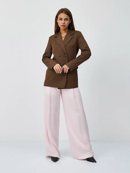 Saffron Blazer by Lauven, oversized double-breasted chocolate blazer styled with pink trousers.