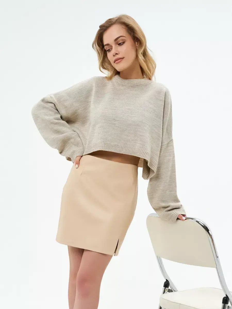 Lauven Sand Sweater in light beige, oversized cropped knit styled with a beige skirt, perfect for versatile fall layering.