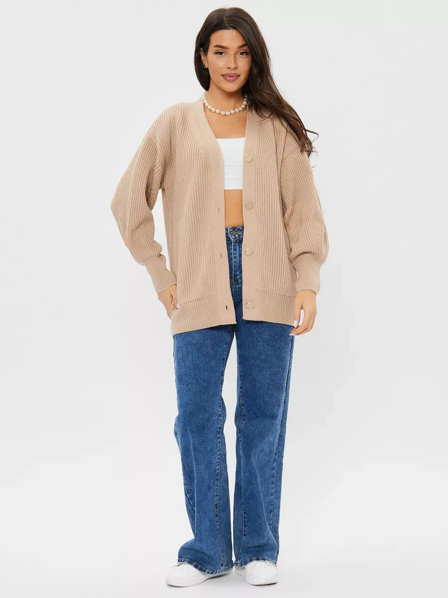Model wearing a Lauven Sandstone Cardigan in beige with relaxed fit, styled with blue jeans and a white crop top.