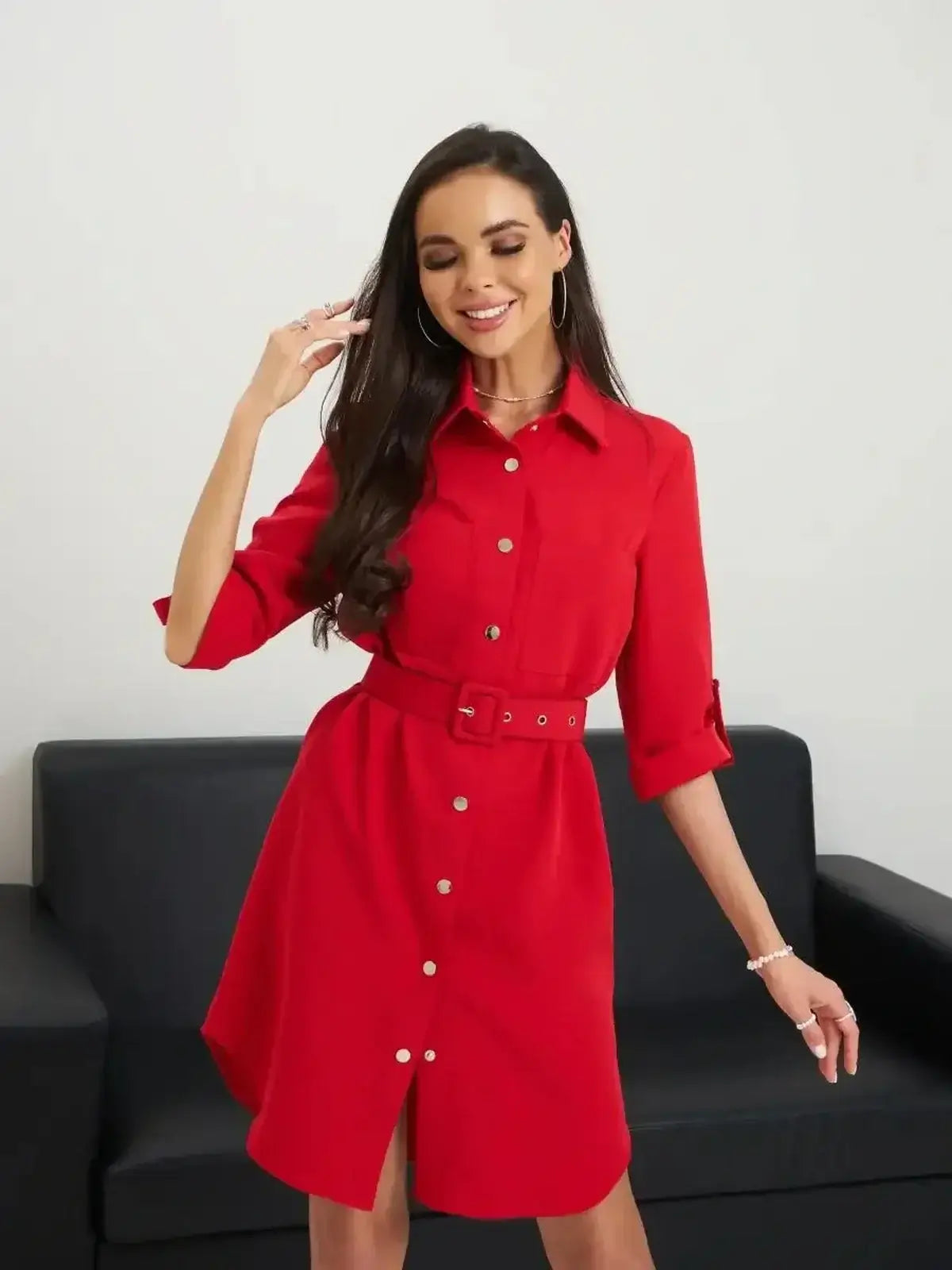 Scarlet Belted Mini by Lauven, showcasing a stylish woman in a red button-up mini dress with a belted waist.