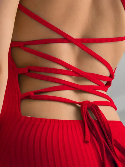 Scarlet Lace Midi Dress back view showcasing the corset lace-up design by Lauven in vibrant red.