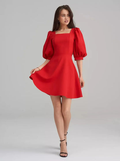 Scarlet Muse Red Mini Dress featuring square neckline, puff sleeves, and flared skirt, perfect for elegant occasions.