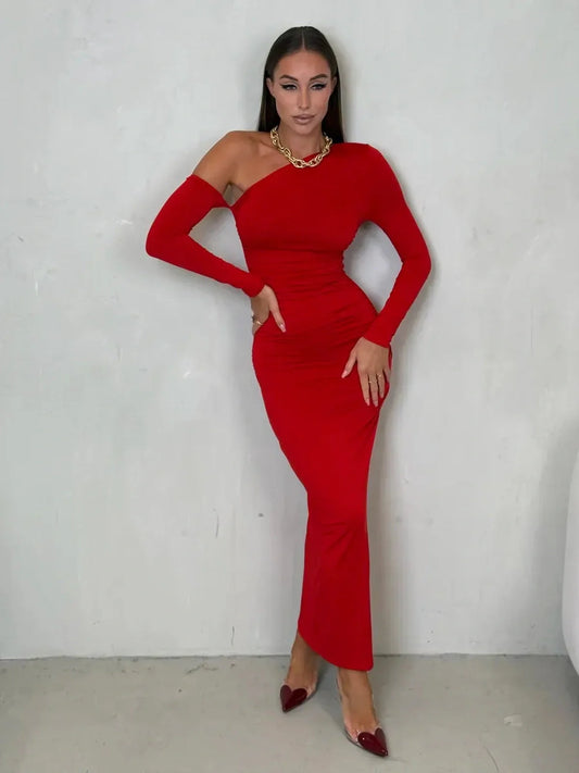 Model showcasing the Scarlet Sculpt Maxi Dress in red, featuring a one-shoulder design and elegant silhouette.