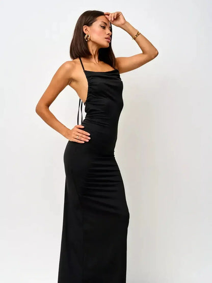 Model showcases the Sculpted Elegance Maxi Dress with convertible straps and ruched bodice, exuding evening sophistication.