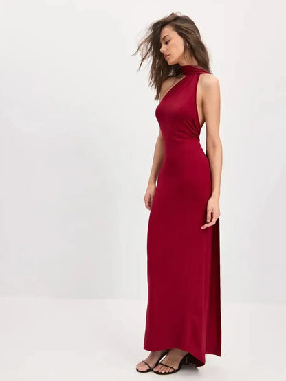 Sculpted Flame Maxi Dress in bold red featuring a one-shoulder silhouette and flowing scarf detail for elegant movement.
