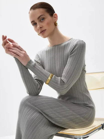 Model showcasing the Sculpted Grace Maxi Dress by Lauven, featuring ribbed elegance and a sculptural fit.