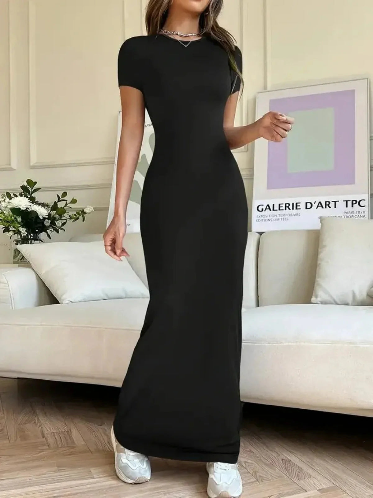 Sculpted Grace Maxi Dress in sleek black, showcasing a fitted silhouette and modern elegance for versatile styling.