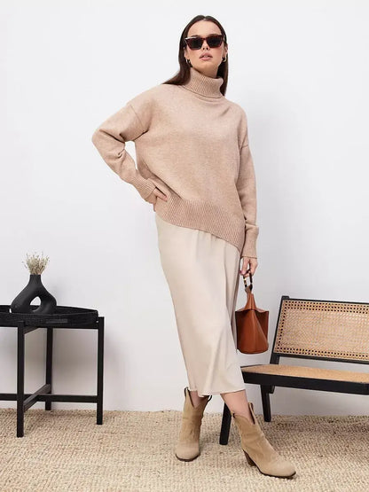 Selene Sweater by Lauven in dark beige worn with a midi skirt, exuding modern style and comfort.