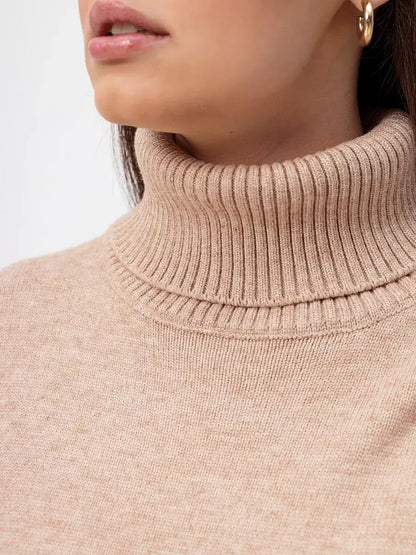 Close-up of the Selene Sweater by Lauven, featuring a dark beige turtleneck for a cozy, stylish look.