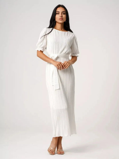 Elegant Seraphine Maxi Dress in white, featuring pleated design and refined silhouette, perfect for summer occasions.