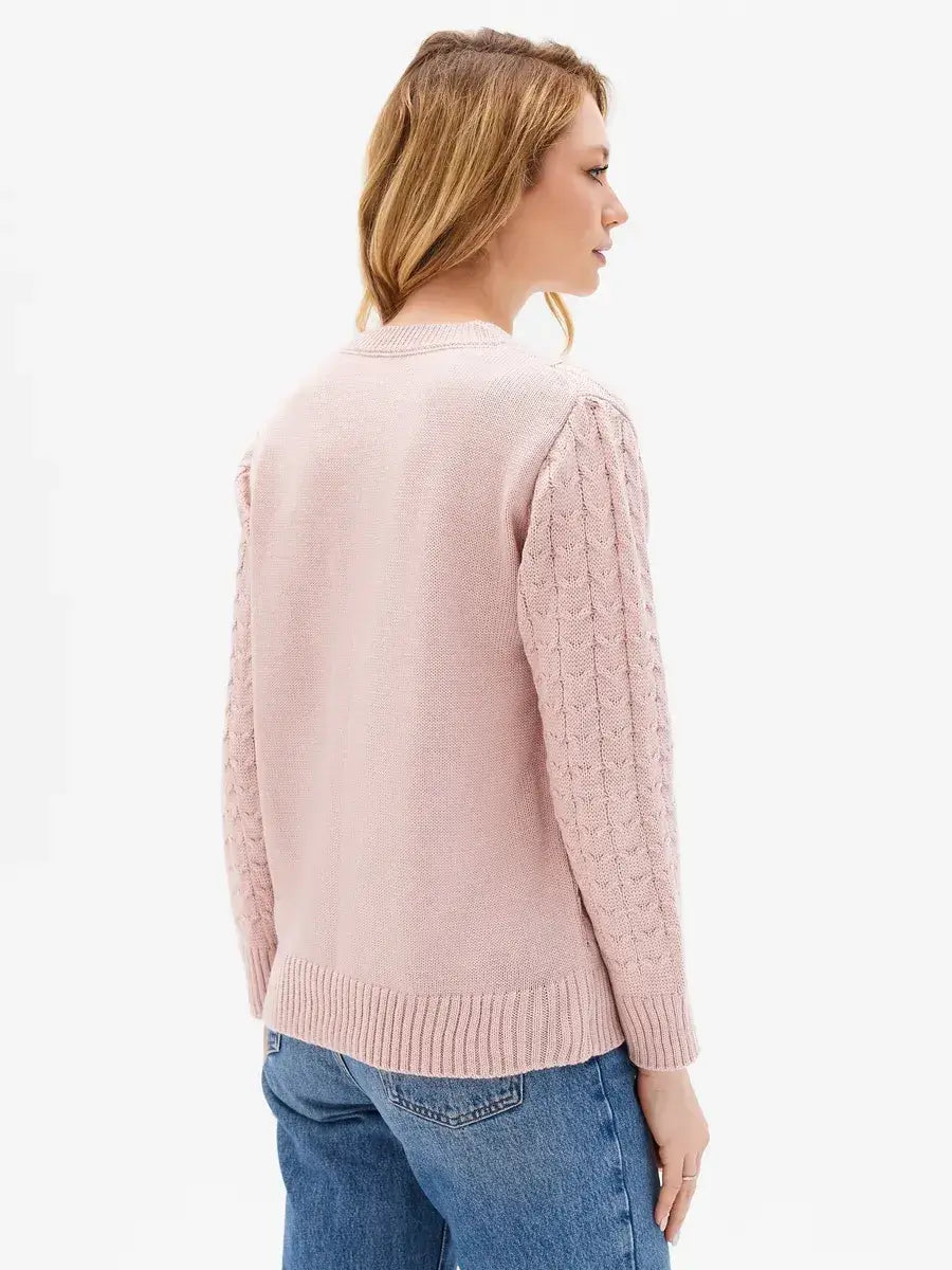 Seren Sweater by Lauven in powder pink, showcasing cable knit sleeves and textured front, perfect for stylish comfort.