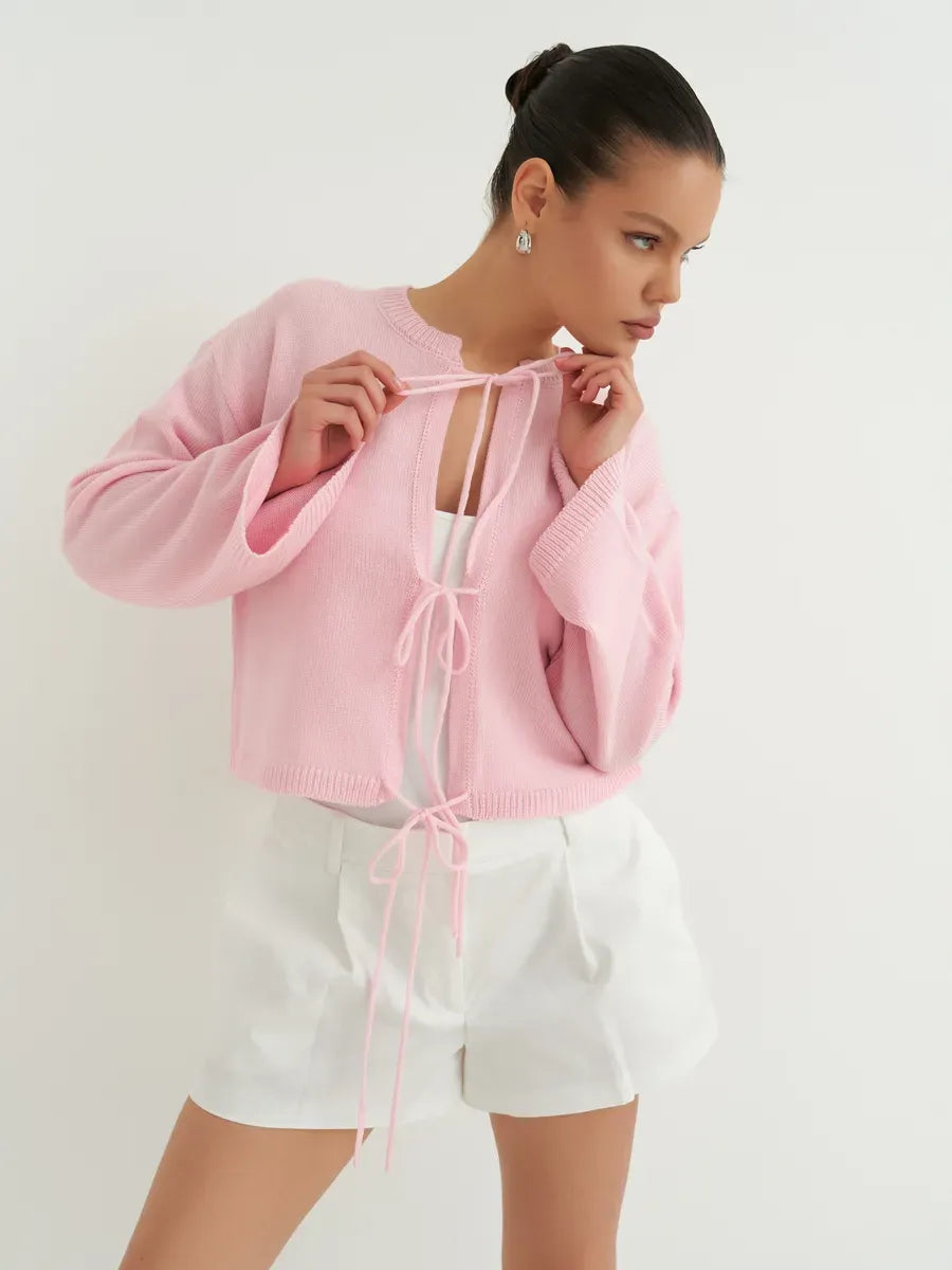 Serena Cardigan by Lauven, lightweight summer knitwear in soft powder pink, perfect for warm weather elegance.