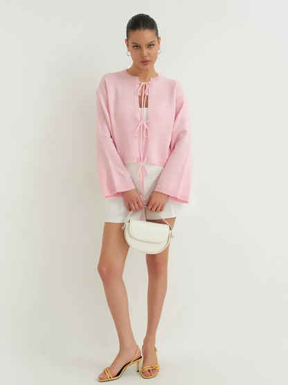 Serena Cardigan by Lauven in soft powder pink, showcasing a lightweight design perfect for summer elegance.