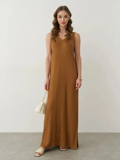 Model showcasing the Serena Maxi Dress in ribbed knit, featuring a flattering V-neckline and floor-length design.