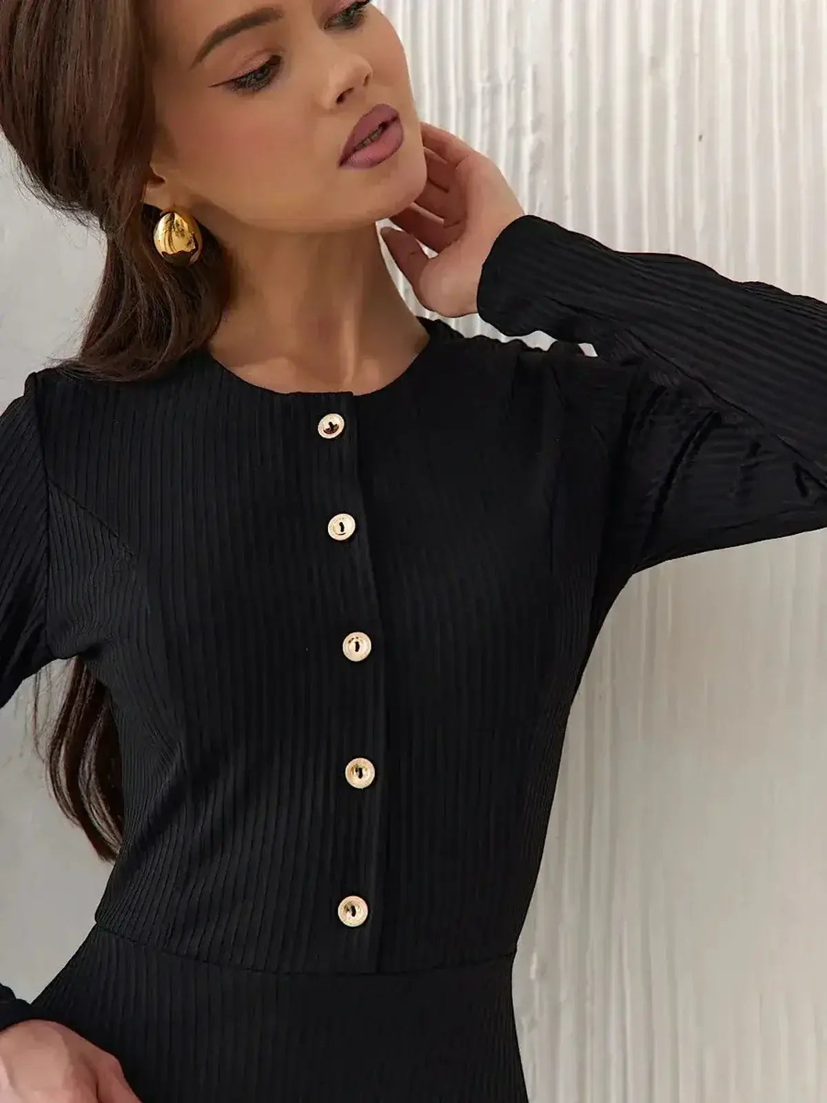 Serene Grace Midi Dress by Lauven showcasing a black ribbed texture and decorative button details.