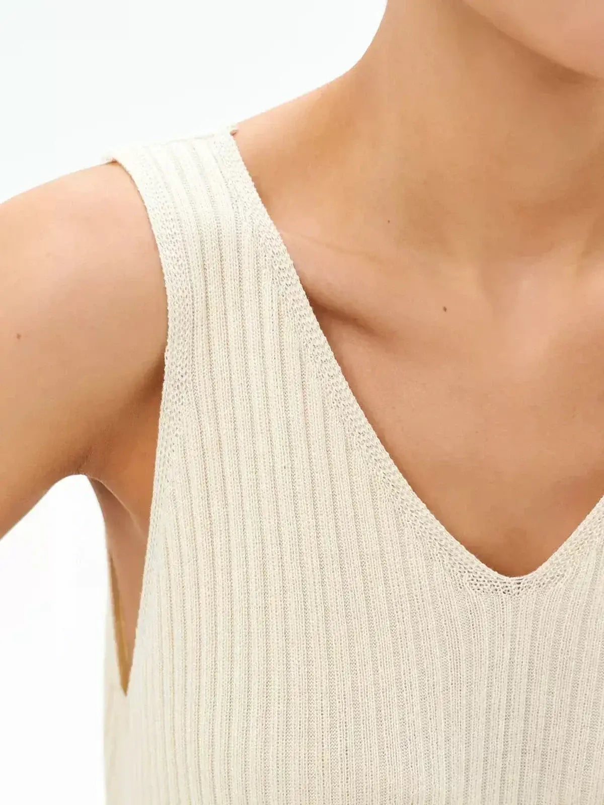 Close-up of the Serene Rib Maxi Dress showing its soft ribbed knit texture and V-neckline design.