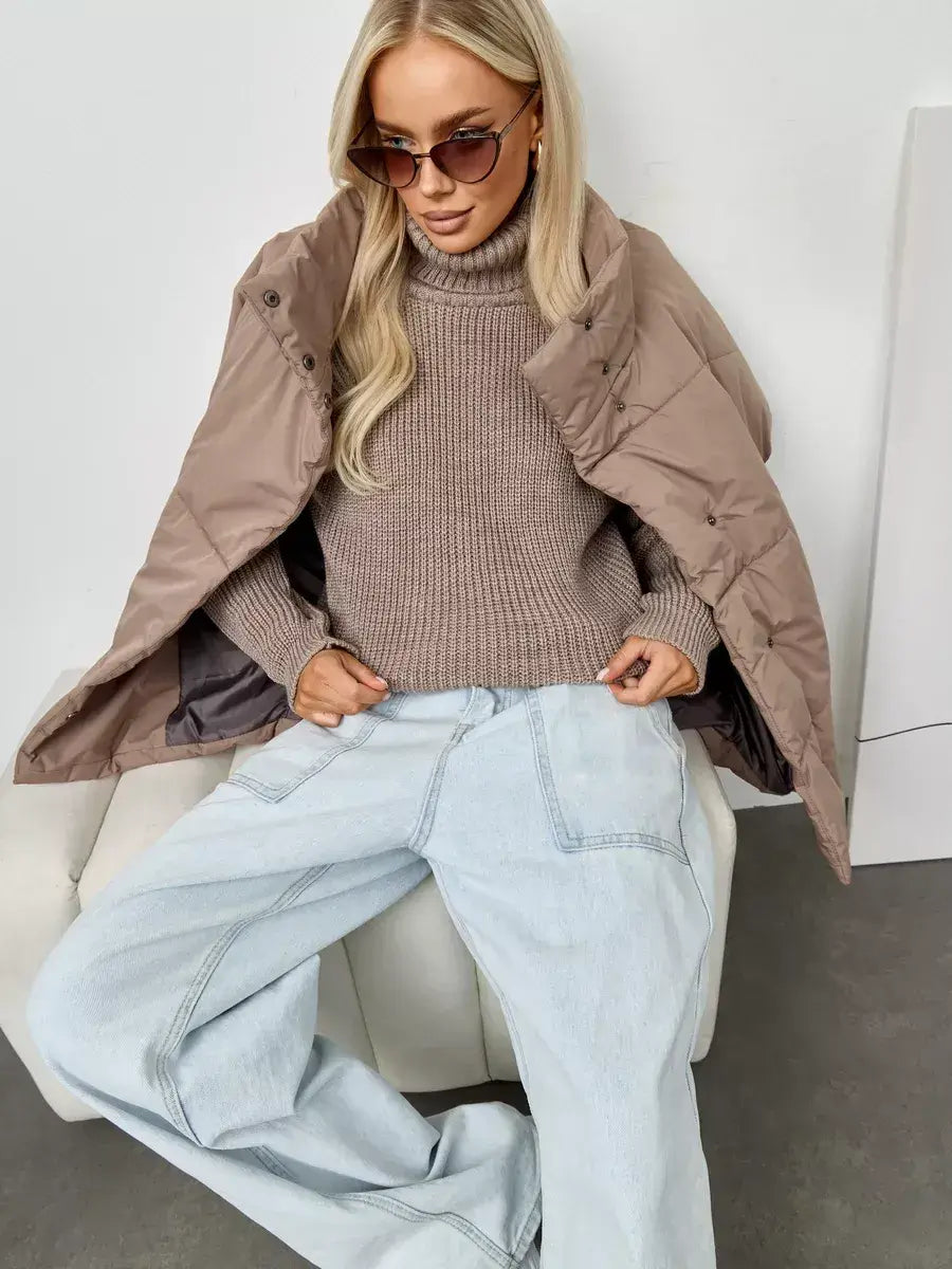 Siena Sweater by Lauven, oversized beige knit with a turtleneck, styled with a tan jacket and denim.