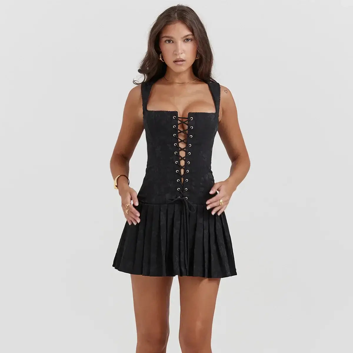 Black Sienna Mini Dress with lace-up front and pleated skirt, perfect for summer parties and elegant events.