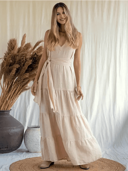 Sierra Maxi Dress in breathable linen, featuring a V-neckline and tiered A-line silhouette, perfect for warm weather.