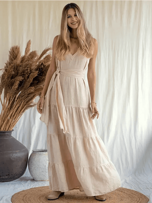 Sierra Maxi Dress in breathable linen, featuring a V-neckline and tiered A-line silhouette, perfect for warm weather.
