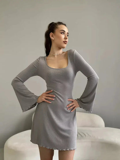 Light gray mini dress with flared sleeves, perfect for summer weddings or cocktail events, showcasing effortless elegance.