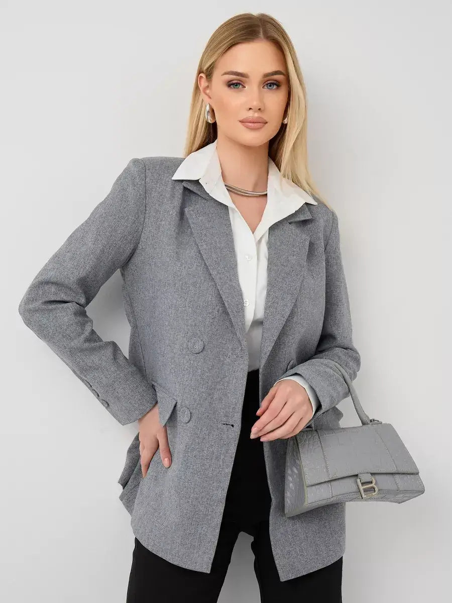 Model wearing the Silverstone Blazer by Lauven, showcasing its oversized gray tailored design.
