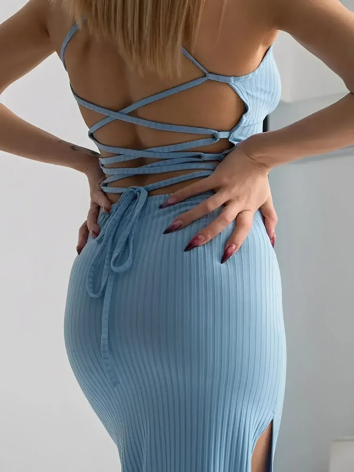 Sky Lace Midi Dress by Lauven showcasing a ribbed bodycon fit and striking open corset back design.