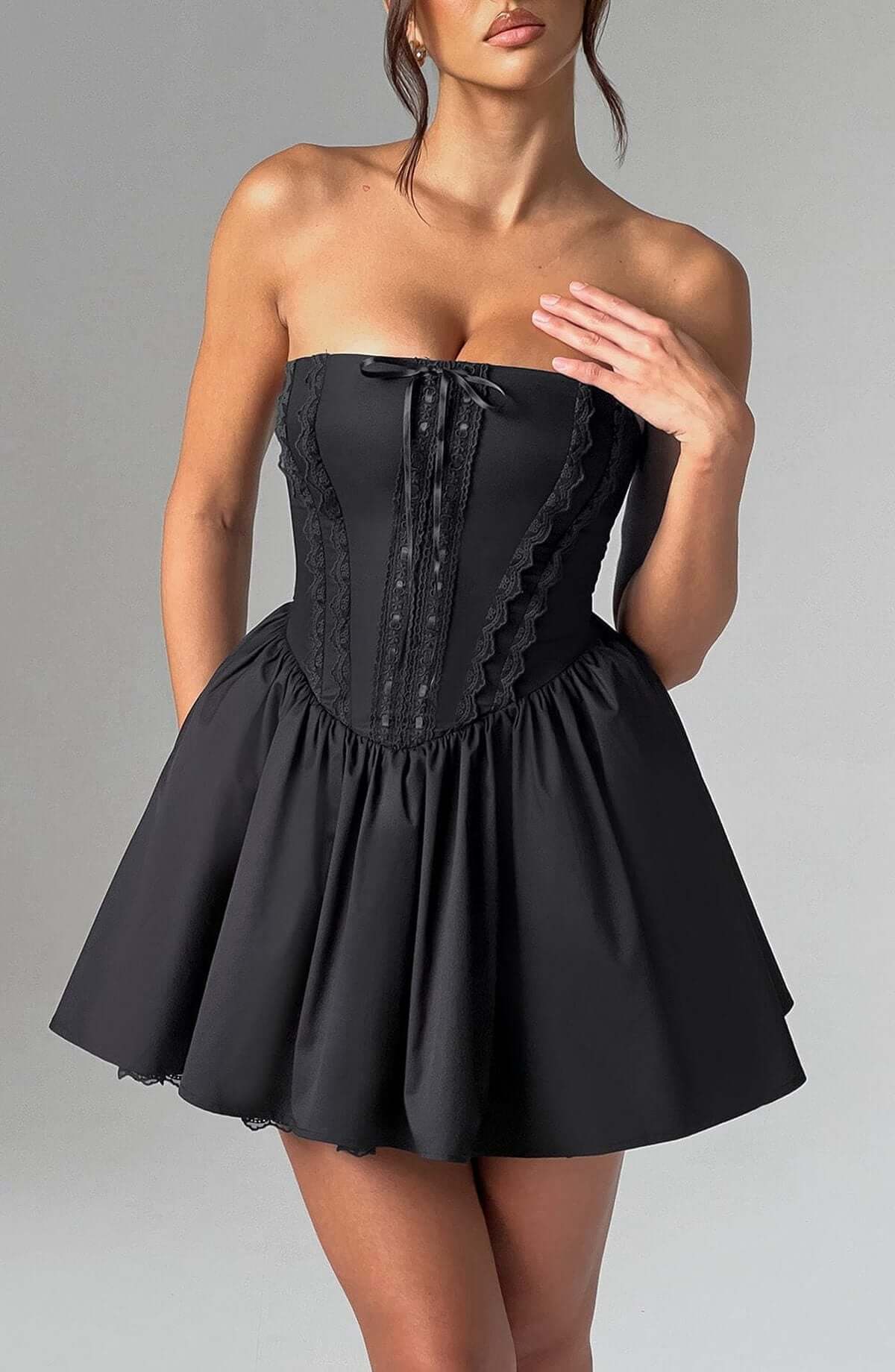 Black strapless mini dress with corset bodice and flared skirt, perfect for cocktail or evening events.